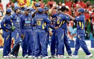 Sri Lankan cricketers celebrate the dismissal of Virender Sehwag (unseen) during the one-day international at Manuka Oval in Canberra on Tuesday. 