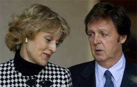 Paul McCartney, and lawyer Fiona Shackleton, leave the high court at lunch time, in London