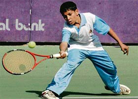 A player in action during the AITA Tennis tourney at CLTA, Sector 10, Chandigarh