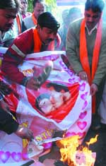 Hindutva activists burn banners and greeting cards to protest against Valentine's Day in the Capital.
