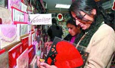 Girls browse through greeting cards at a gift shop on the eve of Valentines Day in the Capital.
