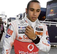 McLaren Formula One driver Lewis Hamilton of Britain walks in the paddock area during a break in his training session at the Jerez racetrack in southern Spain on Wednesday. 