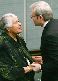 Prominent Australian Aborigine Lowitja ODonoghue (left) and Prime Minister Kevin Rudd talk after Rudd delivered an official apology at the Parliament in Canberra on Wednesday