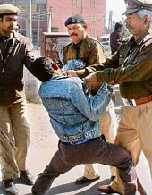 Police personnel try to capture a Shiv Sena worker, who was protesting against the celebration of Valentines Day, in Chandigarh on Thursday.