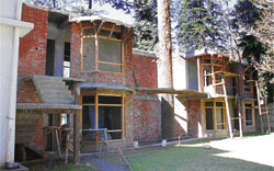 Flats under construction in a green area in Chhota Shimla.