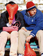 A young couple sit on a bench on The Mall as the BJP men played spoilsport on Valentines Day in Shimla 
