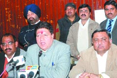 Punjab BJP president Rajinder Bhandari (centre) addresses a press conference in Jalandhar on Thursday. 
