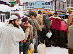 People stand in a queue to get kerosene at Bhaderwah.