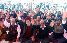 Members of the Federation of Jalandhar Industrial and Traders Association stage a dharna in city