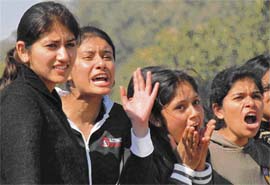 Students of Panjab University cheer for their friends during the university sports festival in Chandigarh on Friday