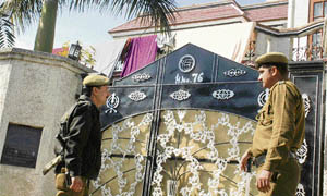 Policemen stand outside the house of Dr Amits father-in-law Sham Lal Saini in Digiana on the outskirts of Jammu on Friday.