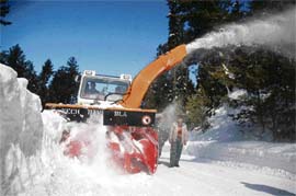 A snow cutter clears a road in Gulmarg on Friday