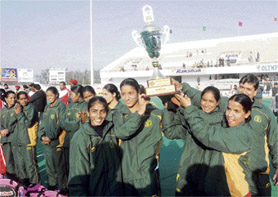 Members of the Indian Railways team hold the trophy after winning the 55th Rakshak Senior Womens National Hockey Championship in Jalandhar on February 9. This was the Railway eves 22nd consecutive title victory. 