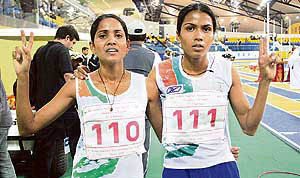 Preeja Sreedharan (left) and Kavita Raut, gold and silver medal winners, respectively, in the 3,000m women's competition during the Asian athletics indoor games at the Aspire sports complex in Doha, Qatar, Friday.