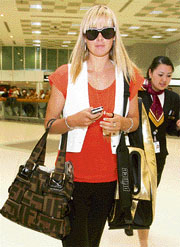 Russian tennis player Maria Sharapova arrives at Doha airport on Friday. Sharapova will take part in the Qatar Open which starts on Monday. 