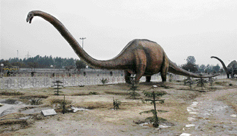 A 140-ft-long model of a dinosaur at the park.