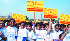 Girl students participate in an anti-female foeticide march from Vijay Chowk to India Gate in the Capital on Sunday. 