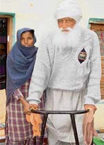 Kartar Singh and his helper