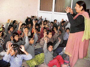 Children of labourers attend a class in the Chetna School of Skills, Hisar. 