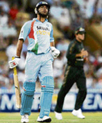 Yuvraj Singh walks back after his dismissal. 