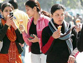 Girls make the most of a sunny day by enjoying ice cream at the Sector 17 Plaza in Chandigarh on Monday.