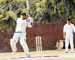Sanjay Jakhmola of AG Uttarakhand hits a six against AG Haryana during North Zone IA and AD cricket tournament at DAV College, Sector-10, Chandigarh, on Monday.