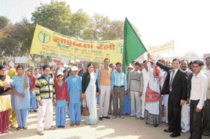 Deputy commissioner O.P. Sheoran and sarpanch Ratna Devi flag off a rally of students in Daulatpur village in Fatehabad on Monday.