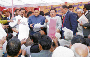 Chief Minister Prem Kumar Dhumal accepts memorandums after a BJP conference at Bilaspur on Monday.