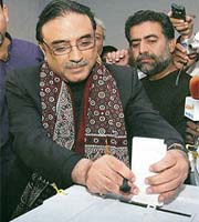 Asif Ali Zardari, widower of Benazir Bhutto, casts his ballot inside a polling station in Nawabshah, 320 km from Karachi