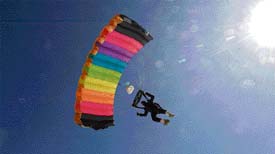 A paraglider hovers before touching down at Gulmarg where the National Winter Games kicked off on Monday. 