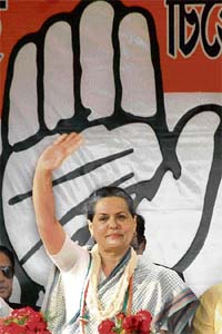 UPA chairperson Sonia Gandhi waves at a rally, ahead of the Assembly elections in Tripura