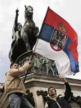 Students wave a flag during a protest in the city centre in Belgrade on Monday. Kosovo Albanians declared independence on Sunday, drawing instant condemnation from Serbia and triggering angry scenes outside the US, Albanian and Slovenian embassies in Belgrade. 