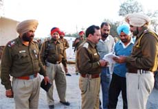 Police officials discuss details about the kidnapping of the three youths from Hanumangarh (Rajasthan) in Bathinda on Tuesday. 