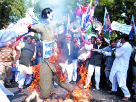 Lok Janshakti Party activists burn an effigy of UP Chief Minister Mayawati in the Capital on Tuesday. They demand steps to improve law and order condition in the state.