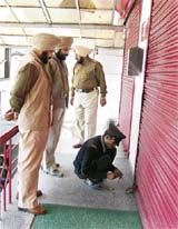 Vishal Mega Mart being locked for violating parking norms in Ludhiana on Tuesday