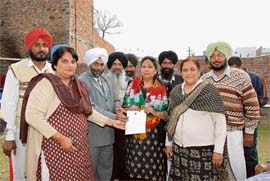 Satinder Kaur Jawandha being honoured after being elected district president of the womens cell in Doraha on Tuesday.