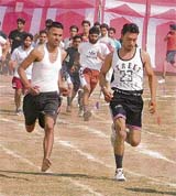 Athletes take part in the 5000m race during the annual sports meet at Kamla Lohtia Sanatan Dharam College in Ludhiana on Tuesday. 