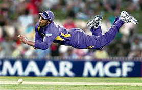 Chamara Kapugedera of Sri Lanka gives his all trying to catch a ball hit by Indias Rohit Sharma during their one-dayer in Adelaide on Tuesday.