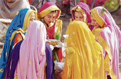 Students partake of lunch during Dangori Mela organised by Guru Nanak Bhawan in Ludhiana