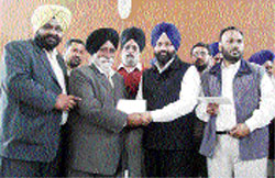 Inder Iqbal Singh Atwal, former MLA, distributes cheques to beneficiaries at Machhiwara