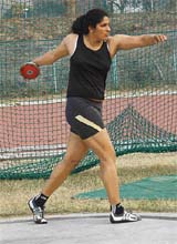 Seema Antil in action during a discus throw event at NIS in Patiala on Thursday.