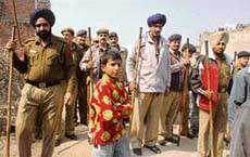 Police at Khudda Ali Sher village following a dispute over land between two parties on Thursday