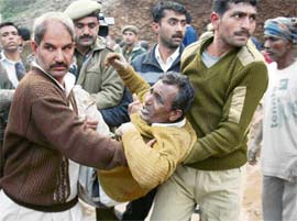 People shifting a person who was injured when an underconstruction wall fell on him at the chief ministers residence on Thursday. 