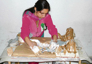 A participant in the Panjab University zonal-level competitions prepares her model in Doraha on Wednesday. 