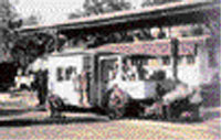 A monorail train pulled by a steam engine on the 