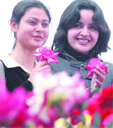 Students admire the 50th Golden Jubilee flower show on the lawns of Faculty of Social Sciences, Delhi University in the Capital