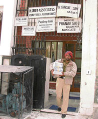 A policeman comes out of the fake institute which claimed to give MA degree from Symbiosis. 
