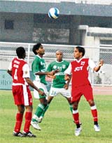 JCT and Salgaocar players battle for the ball in a ONGC-I football league match played at Guru Nanak Stadium in Ludhiana on Saturday