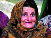 A grand mother in Shignan (Badakshan in Afghanistan) dressed in her Sunday best, with her Lapis Lazuli earrings peeping from under her embroidered shawl.