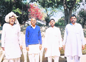 Committee members and other villagers seen inside the Siddh Baba ki Bani in Jhajjar district
